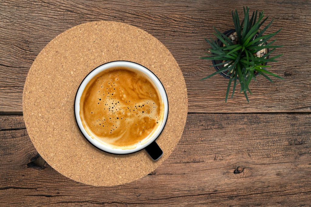 Coffee on a large cork board trivet. Budget-friendly kitchen must-haves.